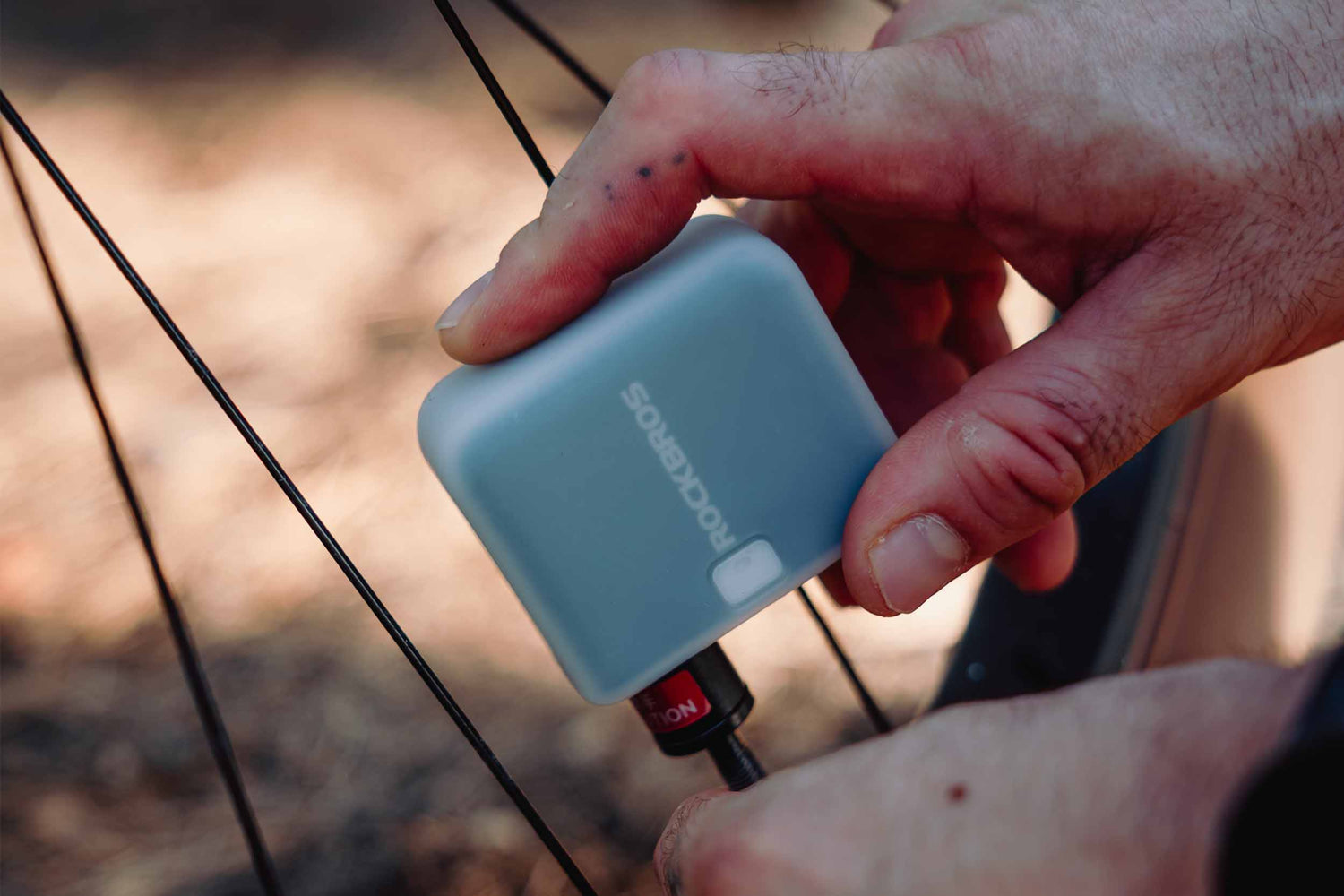 ROCKBROS portable bike pump used during roadside bike tire repair