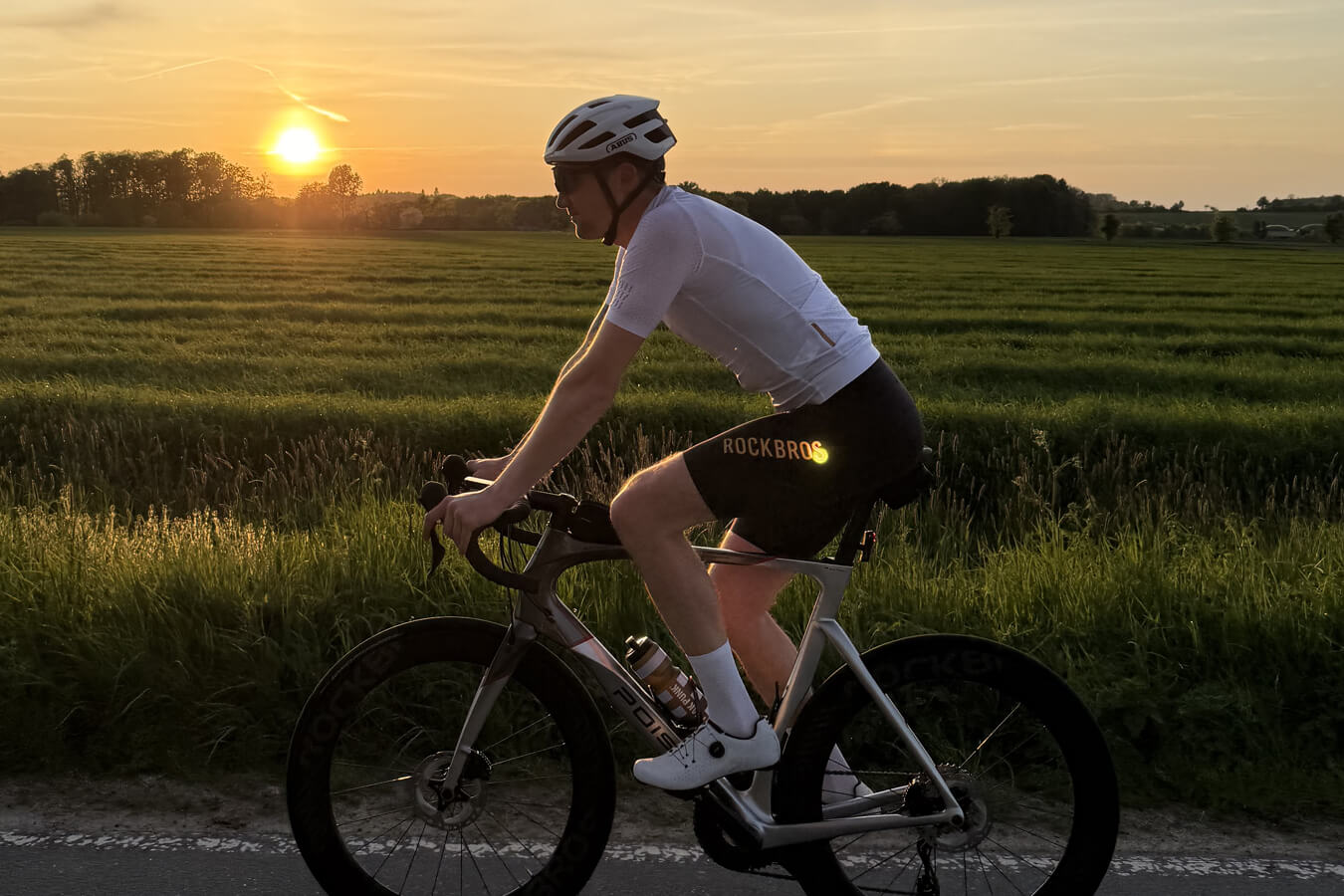 Cyclist wearing layered cycling clothing for different weather