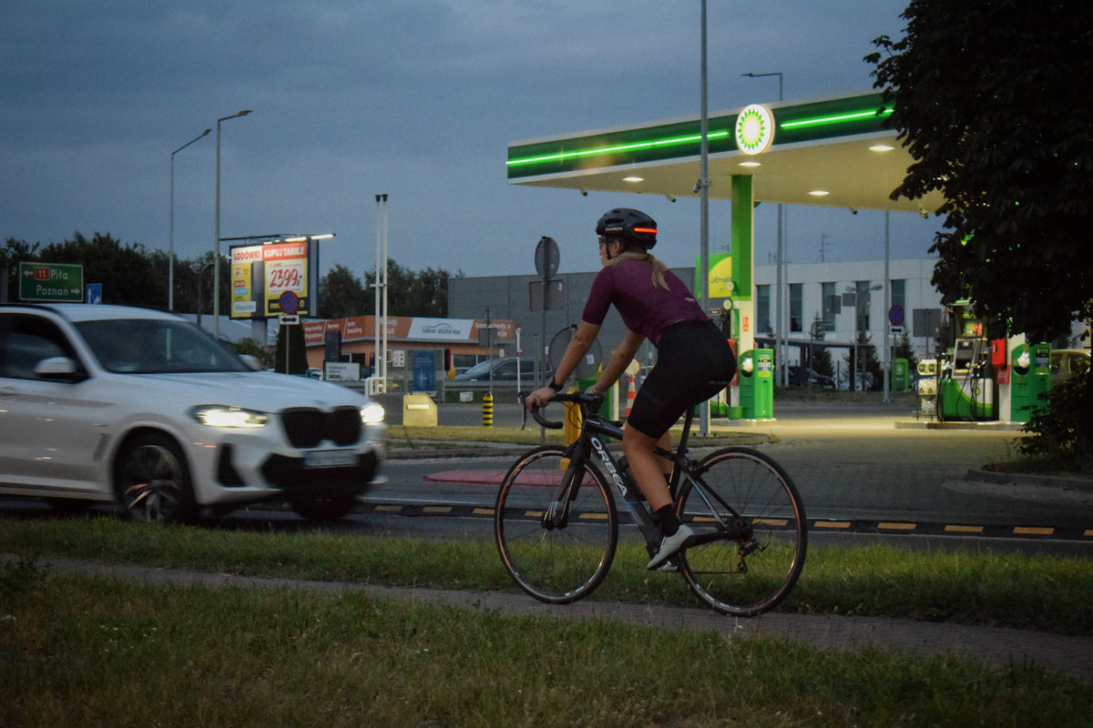 Cyclist wearing a ROCKBROS bike helmet with light riding at night for enhanced visibility