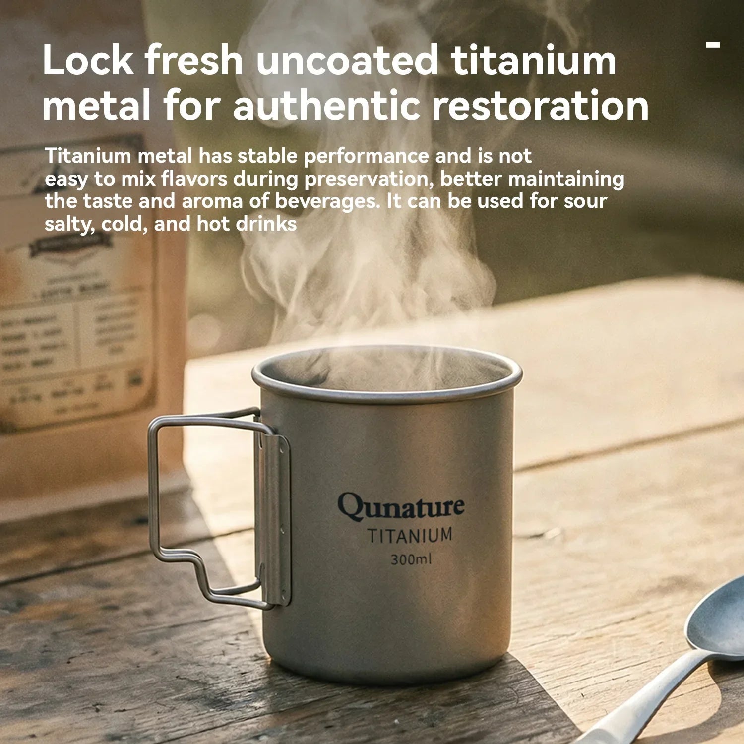 Titanium mug with steam on a wooden surface, featuring Qunature branding.