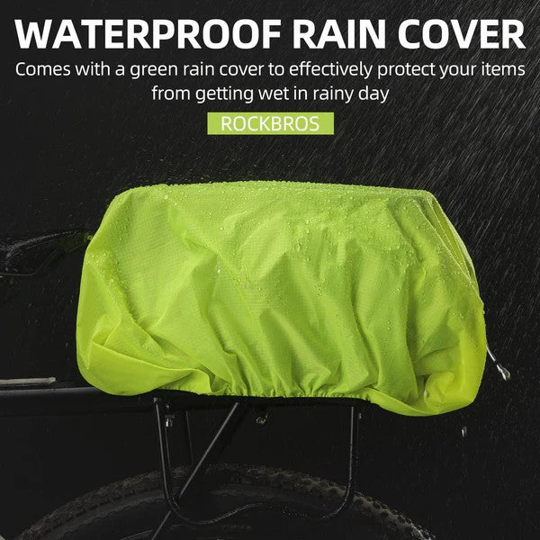 ROCKBROS bike rear rack bag with green rain cover protecting belongings from wind and rain.