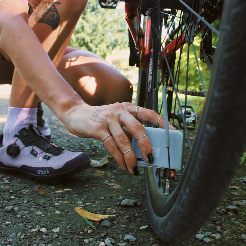 Portable cycling repair kit with pump and essential roadside tools