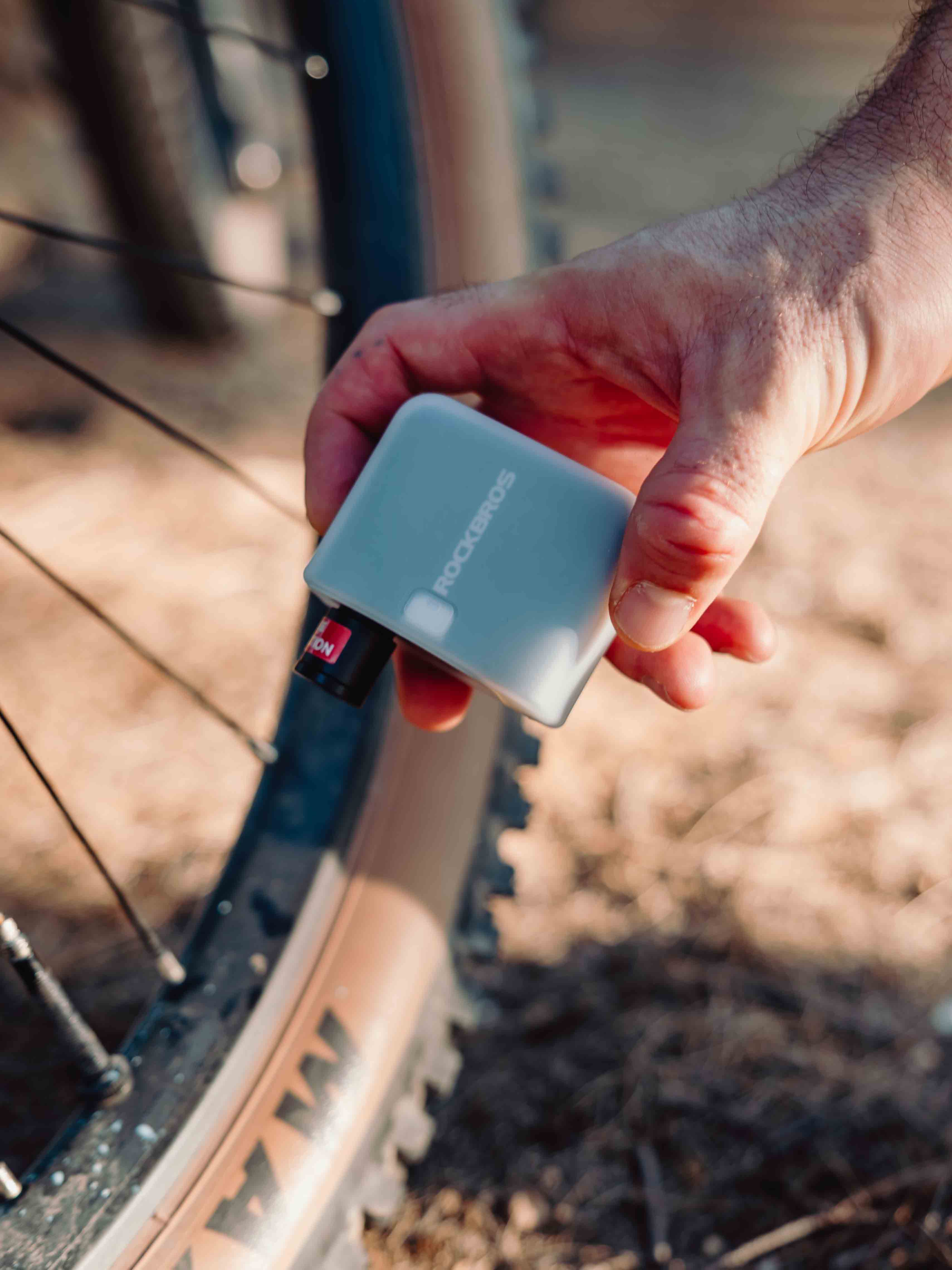 Portable high-pressure mini bike pump compatible with Presta and Schrader valves for roadside repairs.