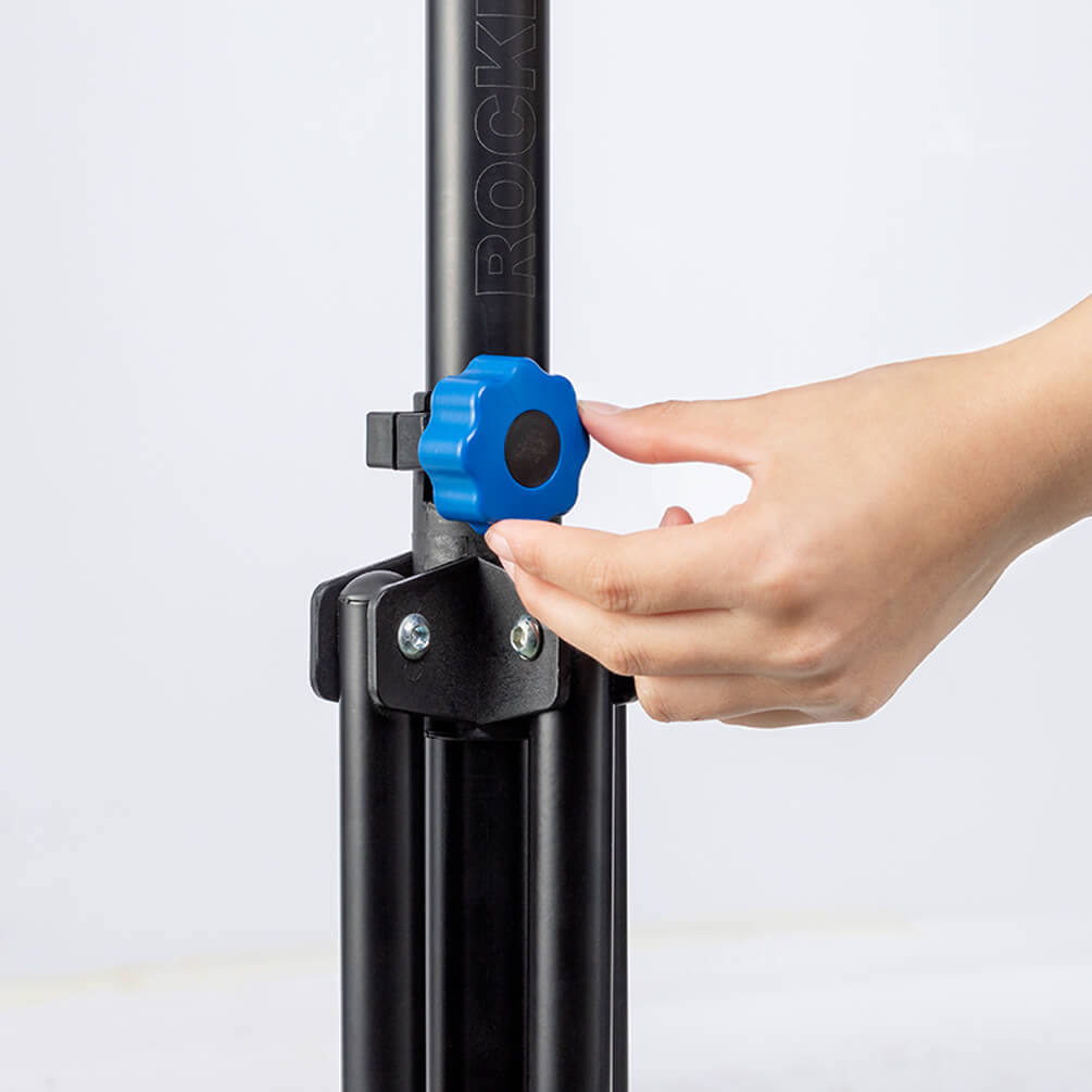 ROCKBROS adjustable telescopic bike repair stand with 360-degree rotating clamp, height adjustment, and foldable four-leg base for bicycle maintenance