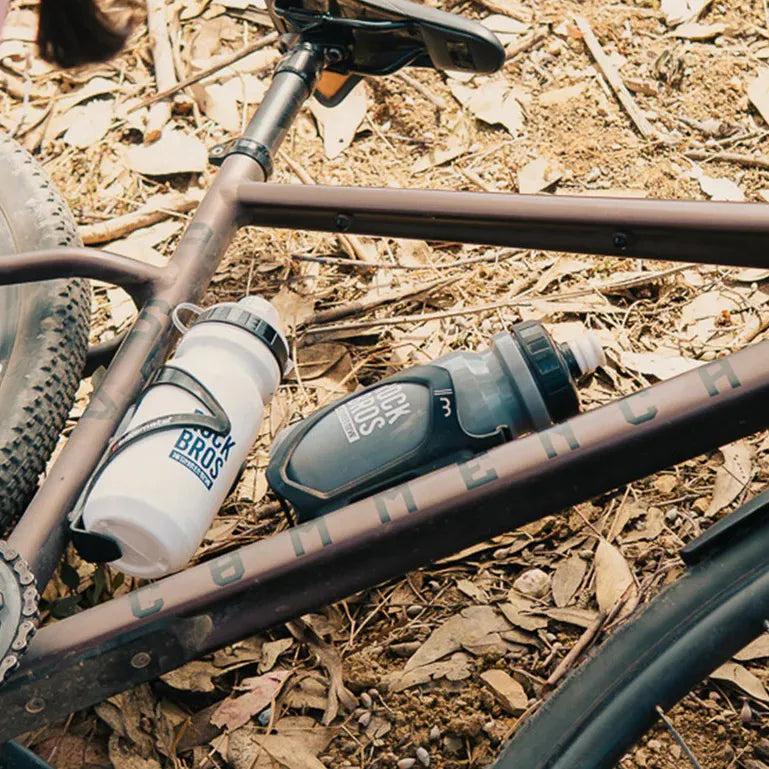 Cycling hydration system with water bottle and bottle cage for summer rides
