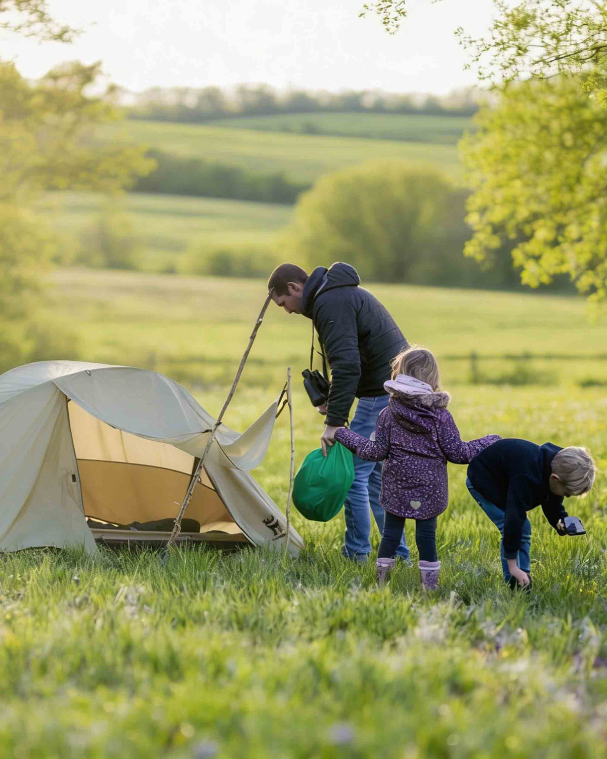 family enjoying a camping trip together outdoors