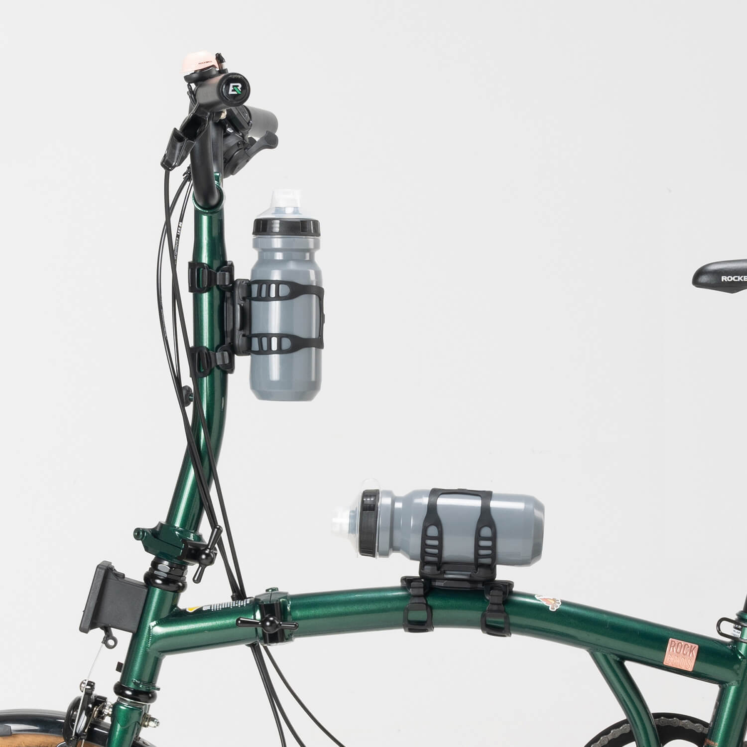ROCKBROS magnetic bike bottle holder with strap and magnetic mount design for secure cycling hydration.