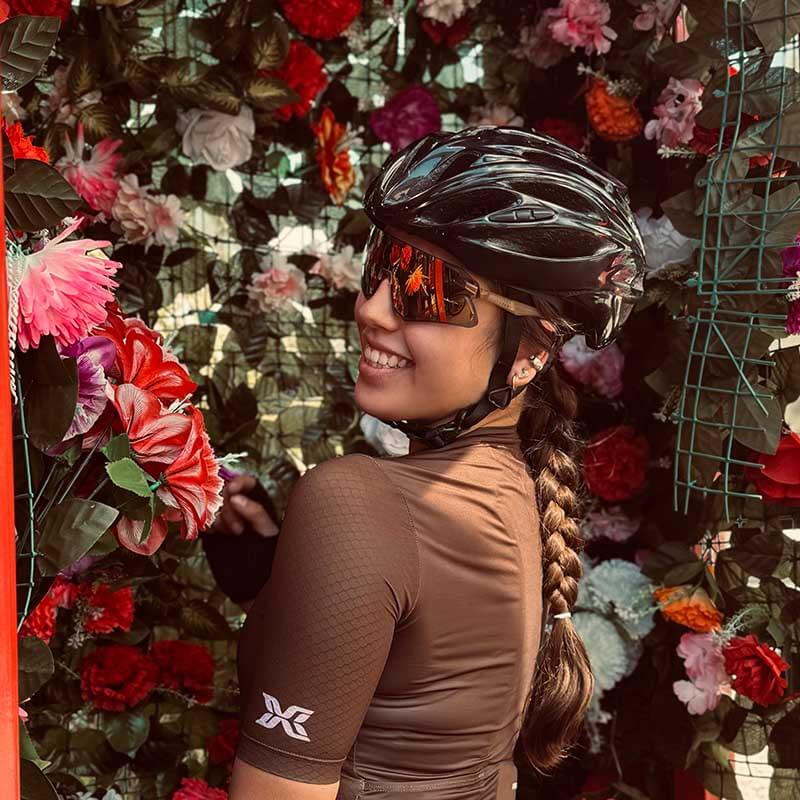 Female cyclist wearing ROCKBROS women’s short sleeve cycling jersey during a ride
