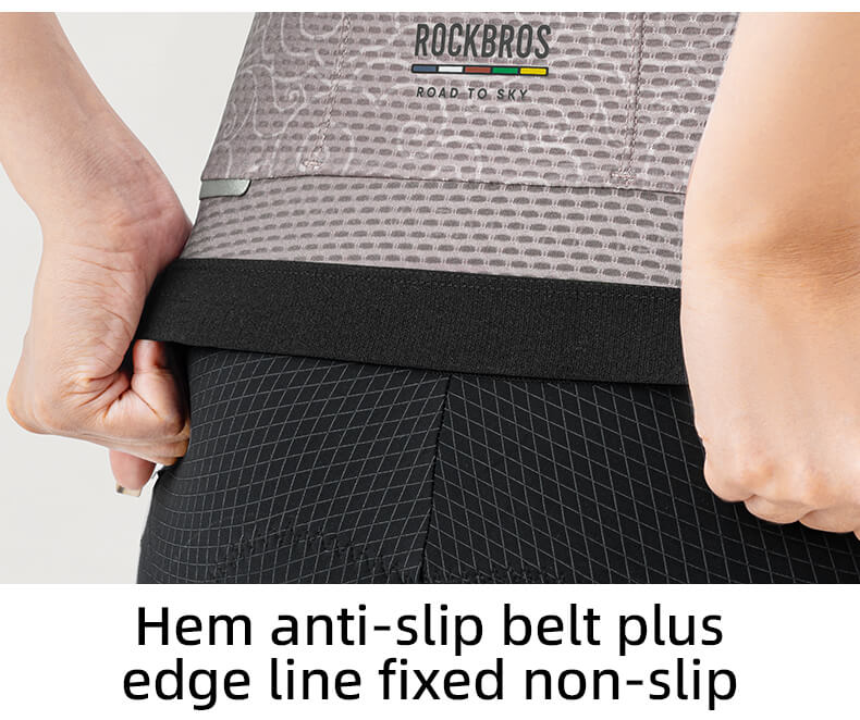 Person adjusting a hem anti-slip belt on a piece of clothing with 'ROCKBROS' branding.